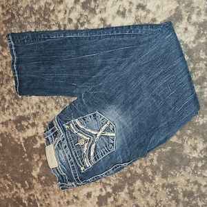 112. Miss Me Size 27 Mid Rise Bootcut jeans